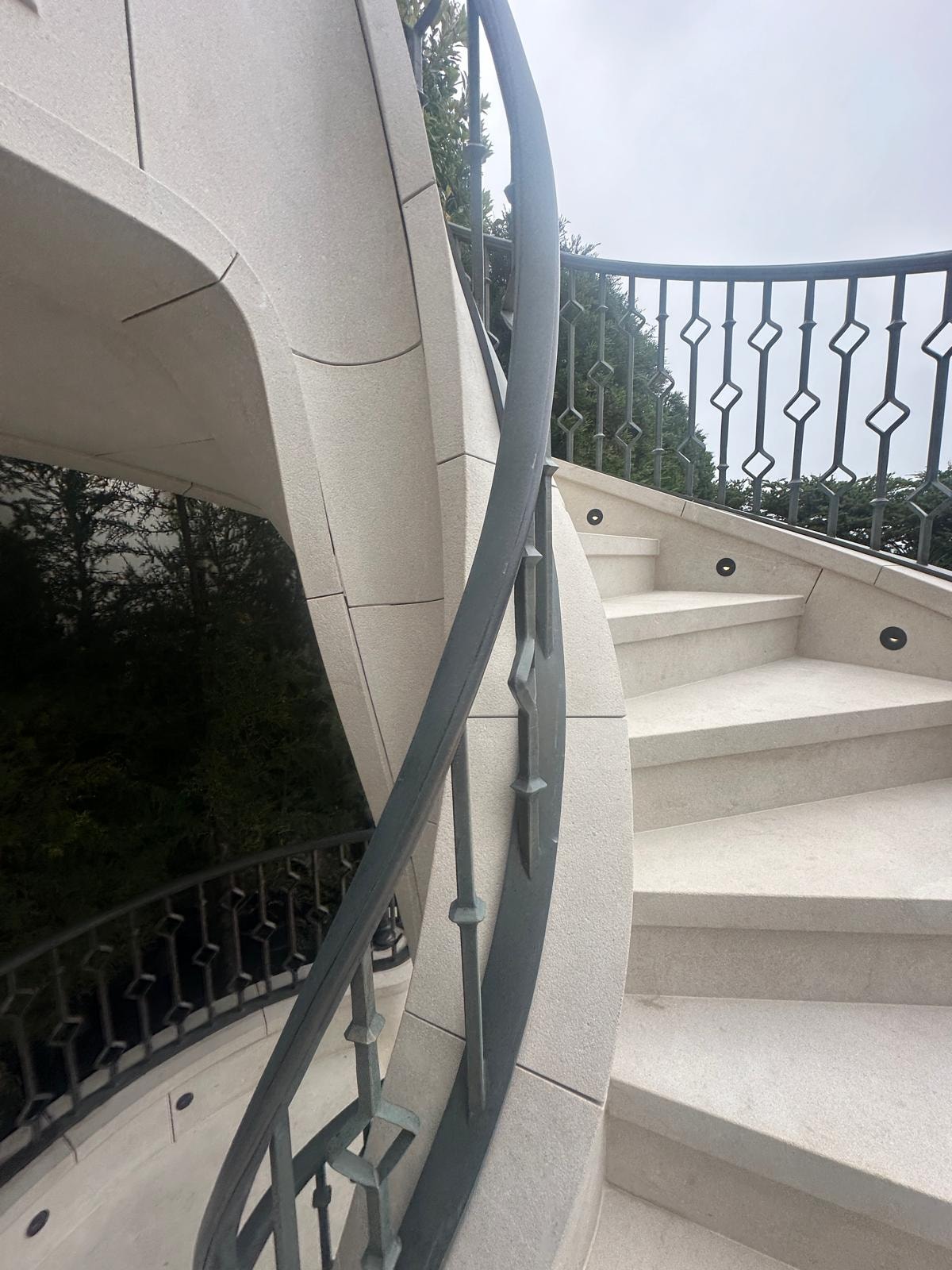 Stone staircase detail with curved balustrade