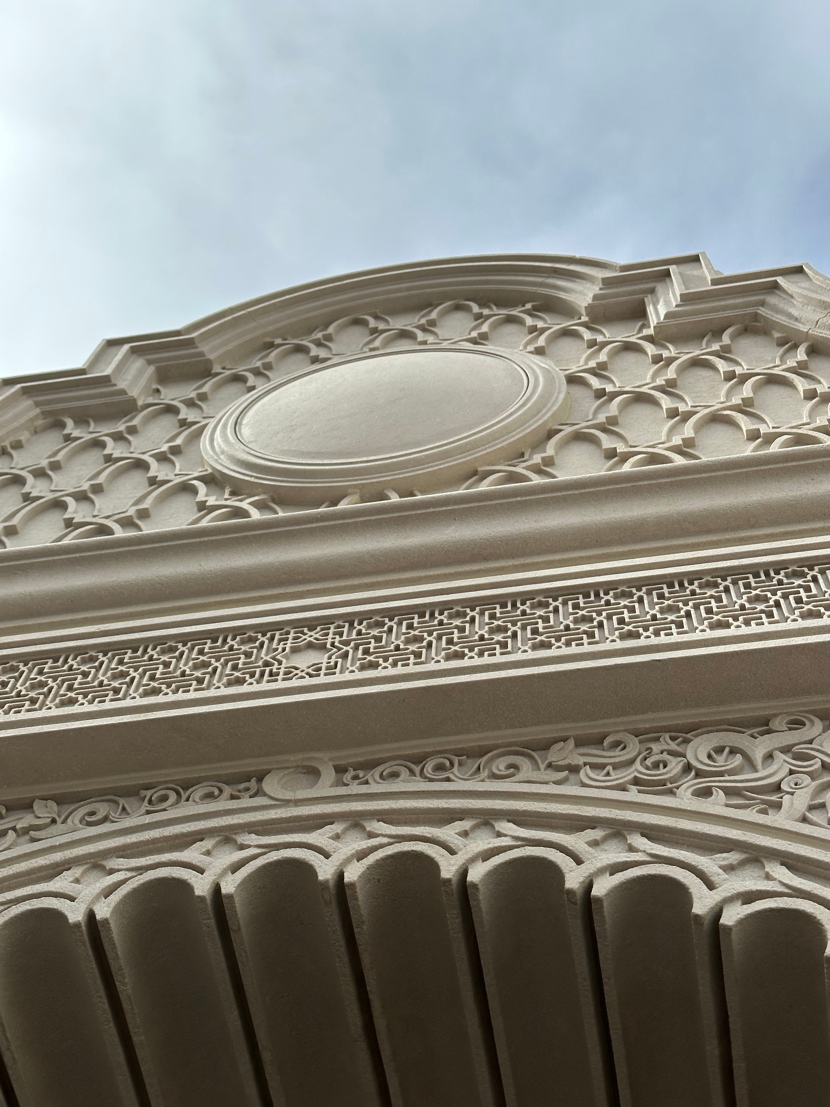 Ornate carved stone cornice and molding detail