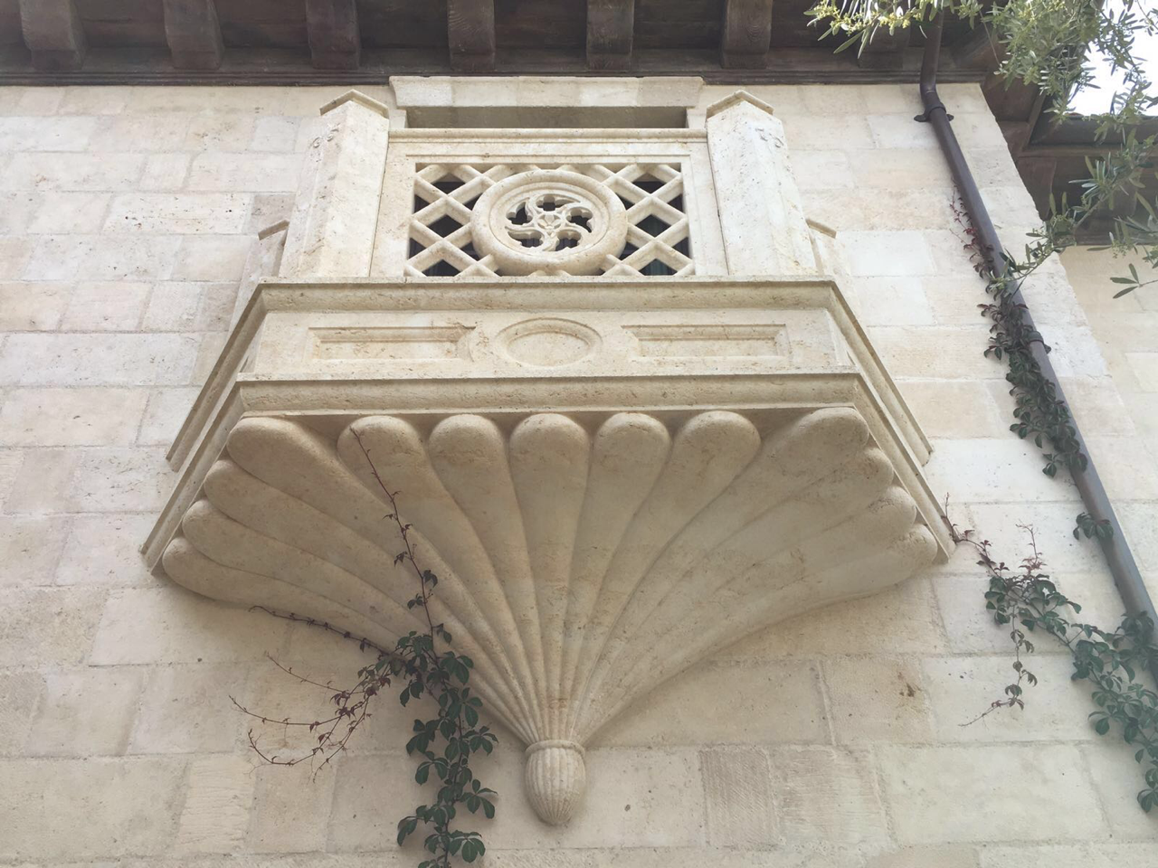 Hand-carved shell corbel architectural detail