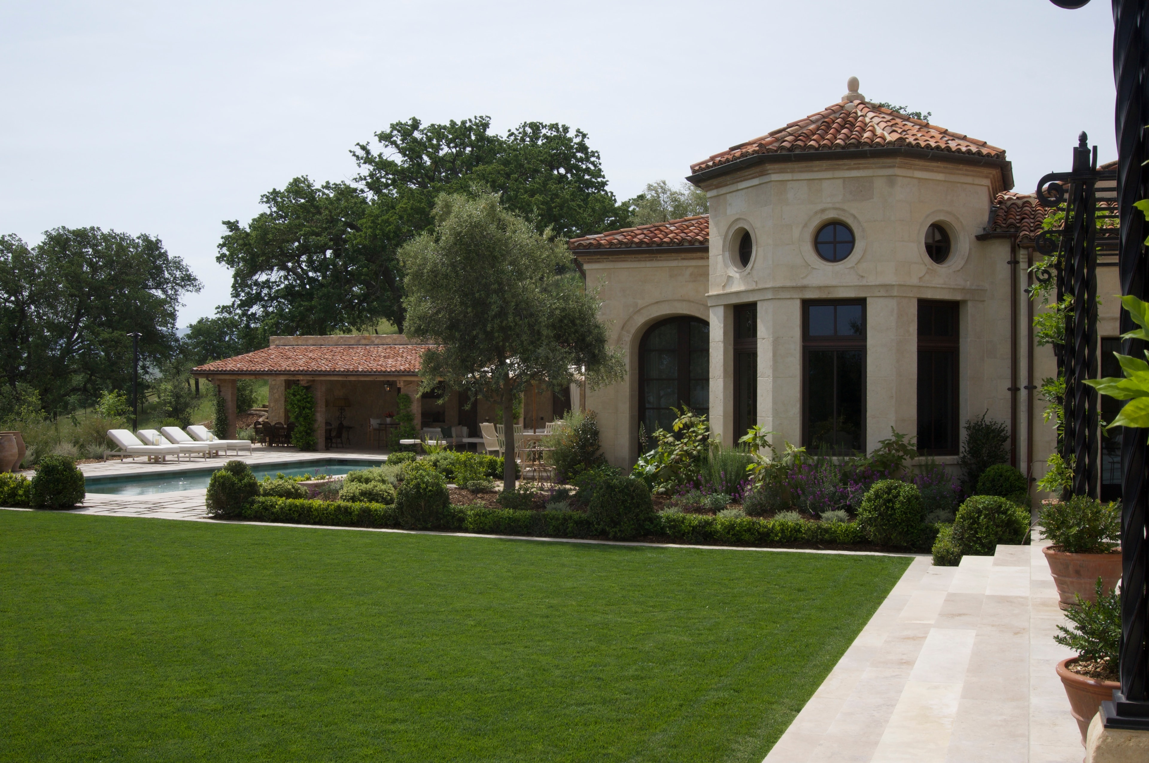 Pool terrace with rotunda and manicured lawn